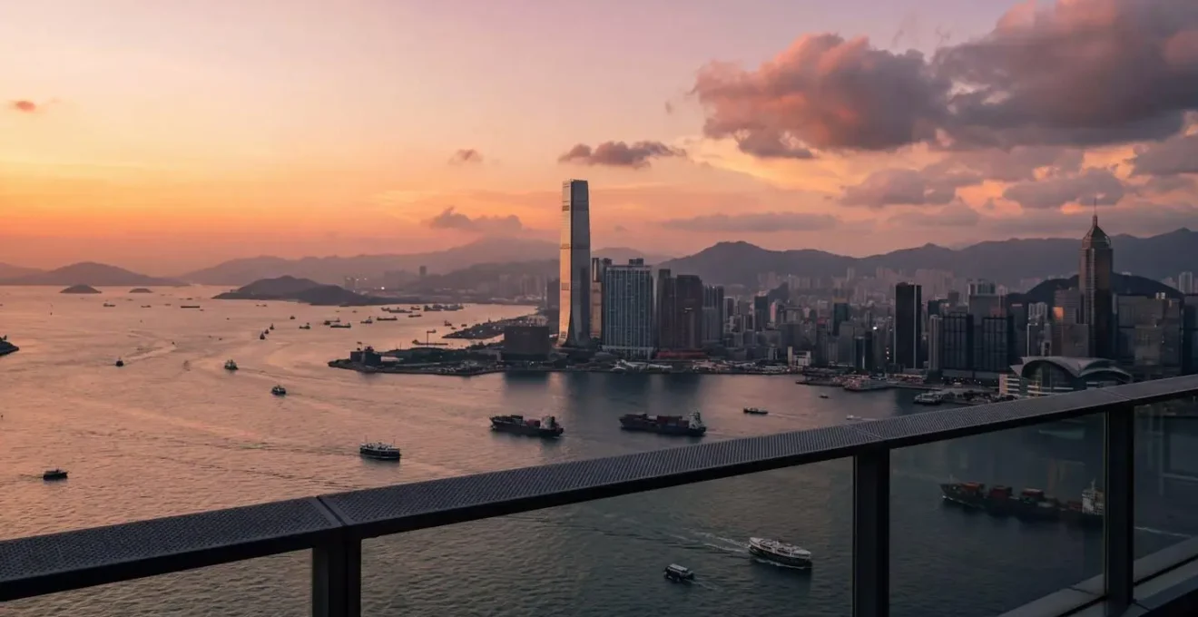 Panoramic view of Victoria Harbour from an observation deck at sunset