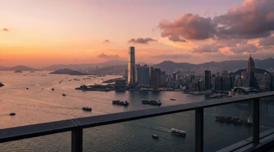 Panoramic view of Victoria Harbour from an observation deck at sunset