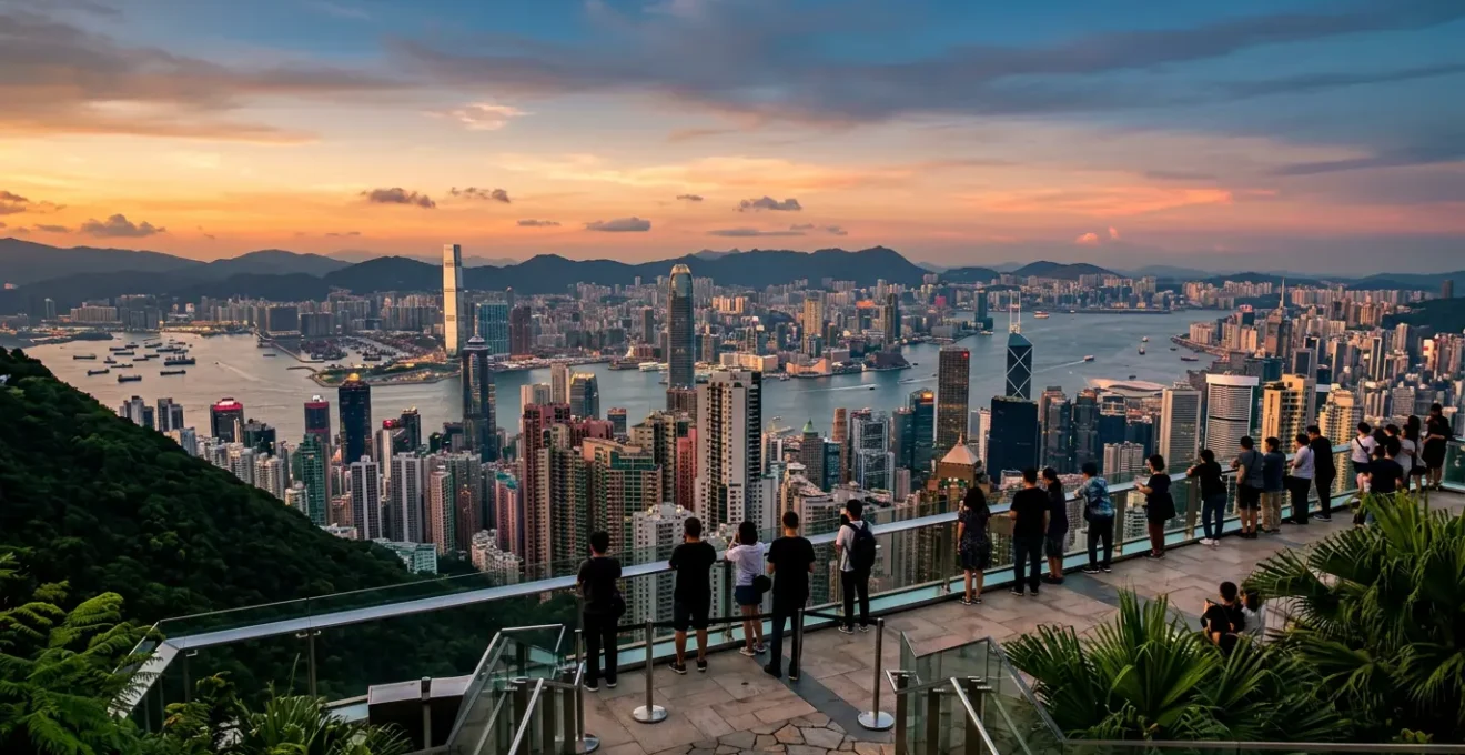 Panoramic view of Hong Kong skyline from Victoria Peak during golden hour with harbor and skyscrapers