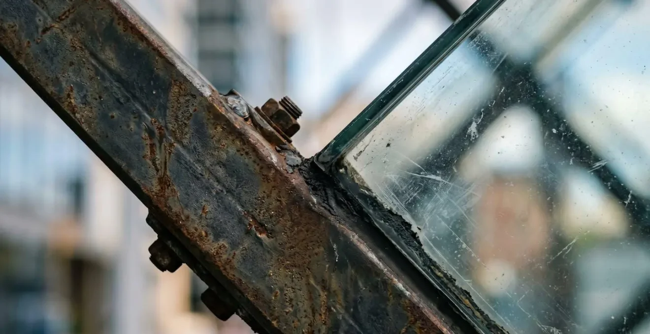 Close-up macro view of structural steel and glass details on a modern skyscraper facade